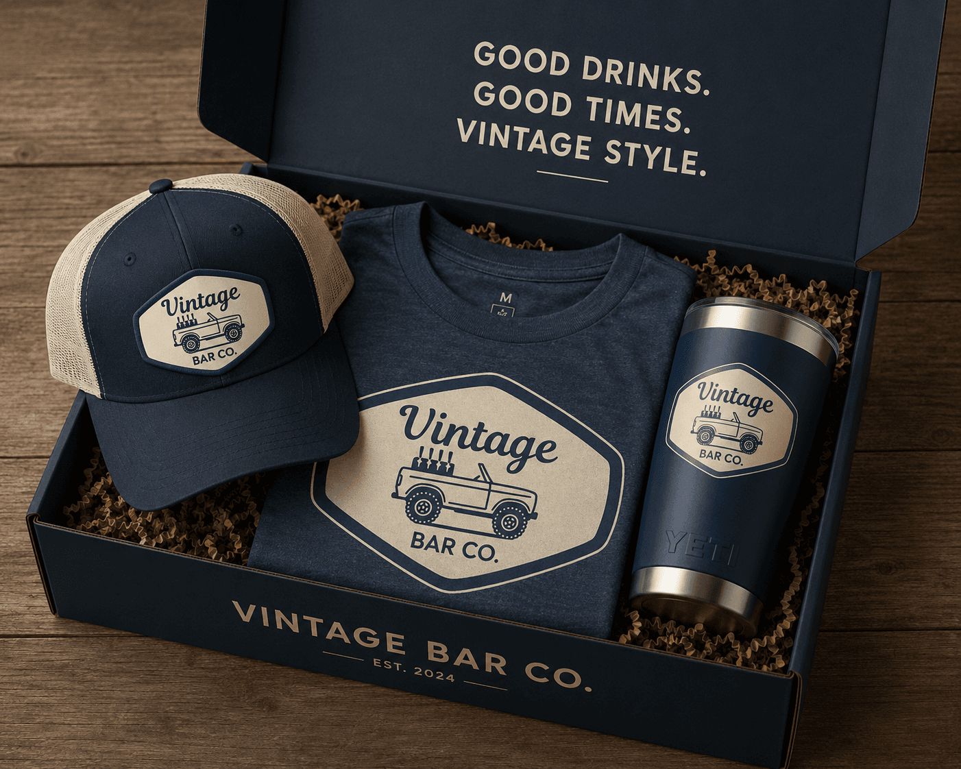 Vintage Bar Co welcome package — branded trucker hat, navy tee, and YETI tumbler in a custom box